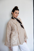 NOIRA blouse in beige .
